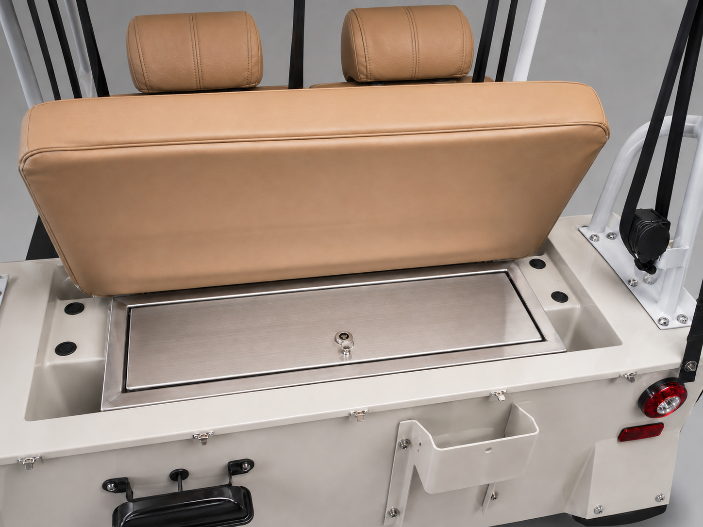 Integrated stainless-steel storage box beneath the raised rear seat